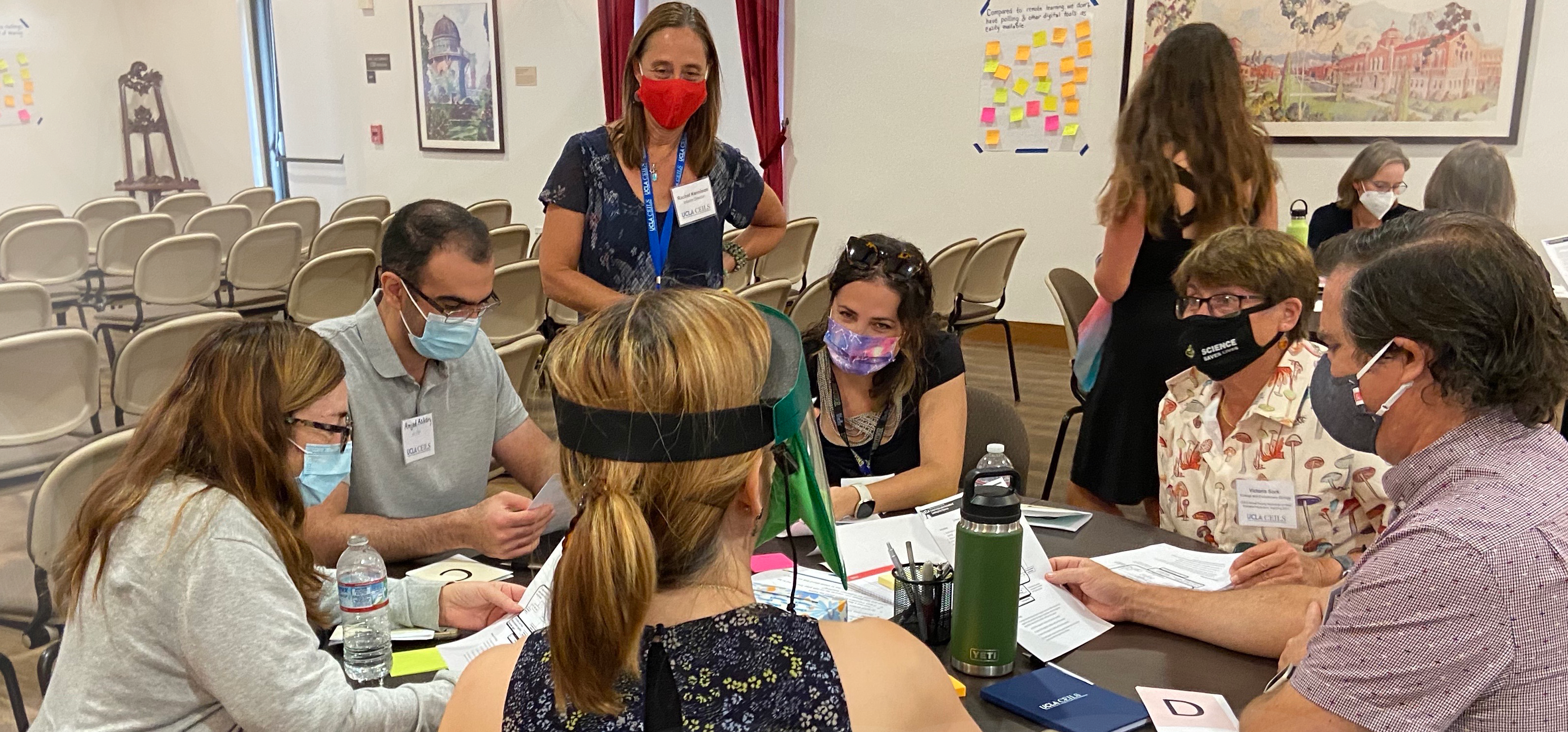 CEILS staff members facilitating a session and overseeing a group activity discussion