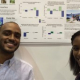 Students standing in front of poster